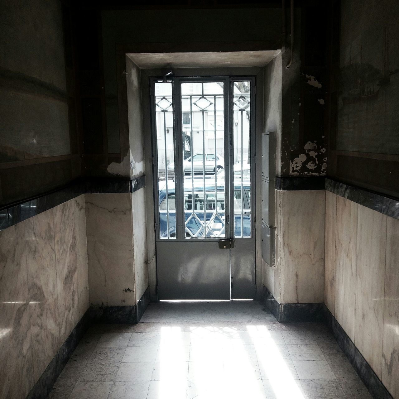 indoors, architecture, built structure, window, door, corridor, empty, house, absence, flooring, the way forward, building, sunlight, narrow, doorway, building exterior, wall - building feature, wall, day, entrance