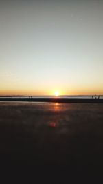 Scenic view of sea against clear sky during sunset