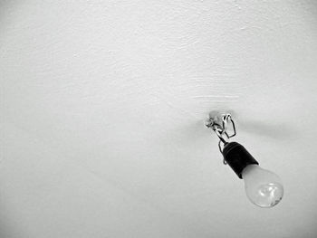 High angle view of water hanging on metal