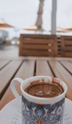 Close-up of coffee cup on table