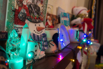 Close-up of christmas decorations on table at home