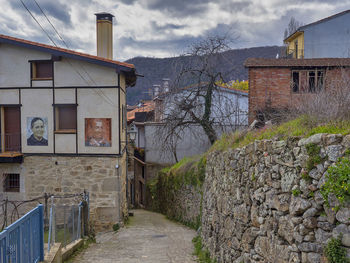 Street amidst buildings against sky