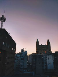 Cityscape against clear sky during sunset