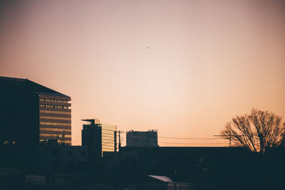 Low angle view of buildings at sunset