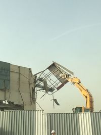 Low angle view of factory against clear sky