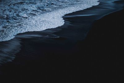 Waves reaching shore at beach