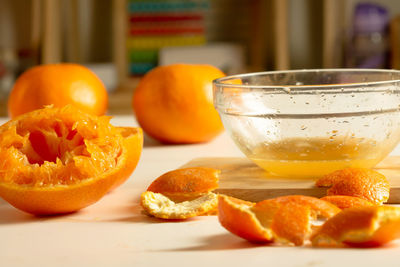 Close-up of orange juice on table