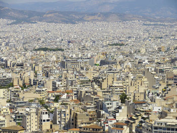 High angle view of cityscape by mountains