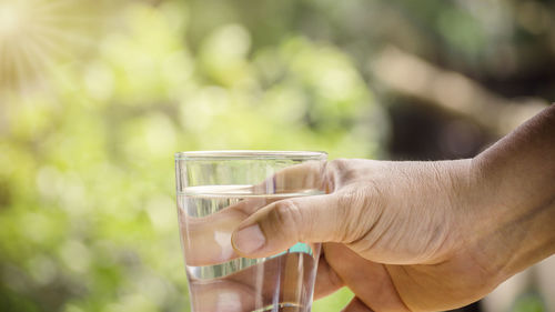 Close-up of hand holding drink