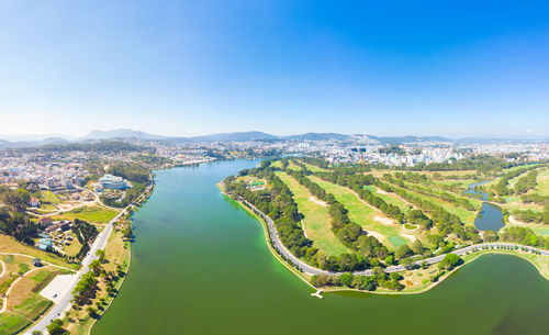 High angle view of cityscape against clear blue sky