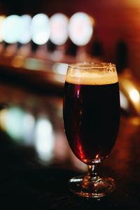 Close-up of beer in wineglass on table