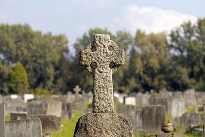 Stone cross in cemetery