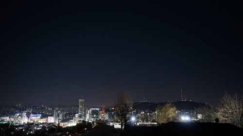 Illuminated buildings in city at night