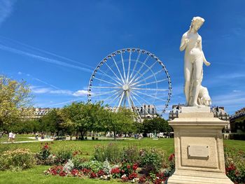 Low angle view of statue against cloudy sky