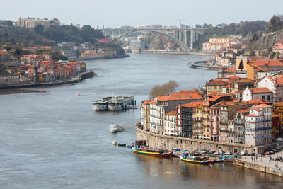 High angle view of river and buildings in city