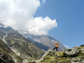 Woman standing at himalayas against sky