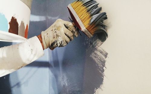 High angle view of hand painting on table