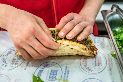 Midsection of man preparing food