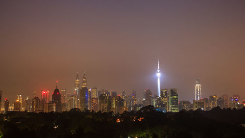 Illuminated buildings in city at night