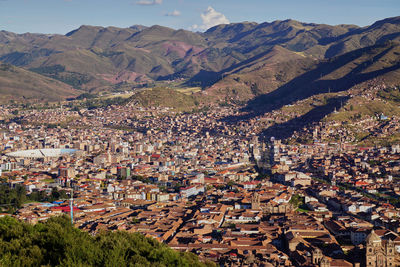 High angle view of townscape and mountains