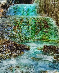 Water flowing through rocks in forest