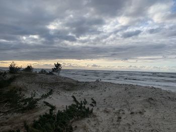 Scenic view of beach against sky during sunset