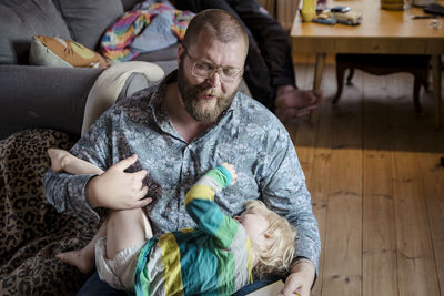 Father playing with daughter