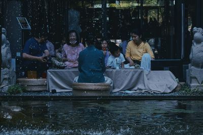 Group of people in front of water