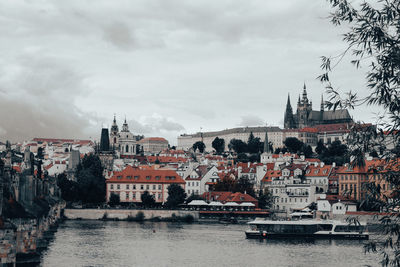 Buildings in town against sky