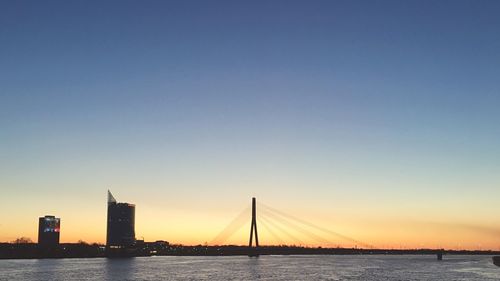 View of bridge over sea against clear sky