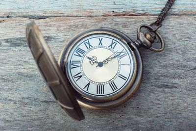 Close-up of clock on table