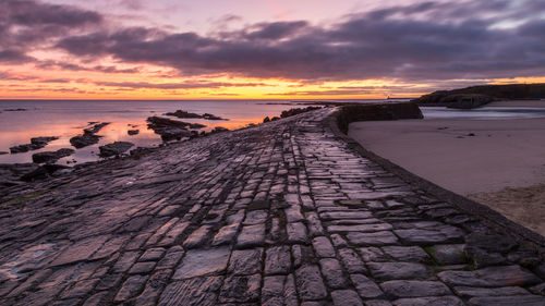 Scenic view of sea against dramatic sky