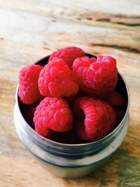 High angle view of strawberries in bowl on table