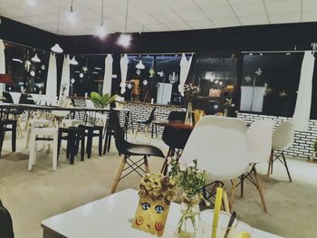 Chairs and table in illuminated room