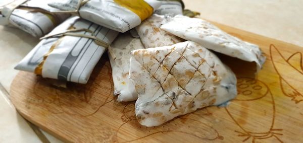 High angle view of bread on cutting board