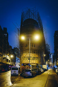 Illuminated city street at night