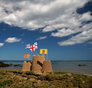 Scenic view of beach against sky