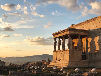 Old temple against sky during sunset