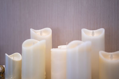Close-up of illuminated candles on table