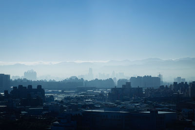 Cityscape against blue sky