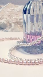 Close-up of necklace on table