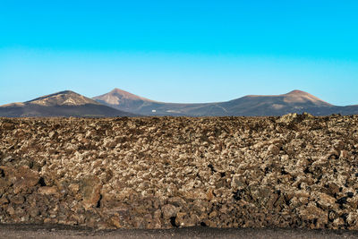 Scenic view of desert against clear sky