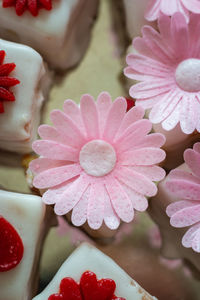 Close-up of colorful petit fours with flower decoration