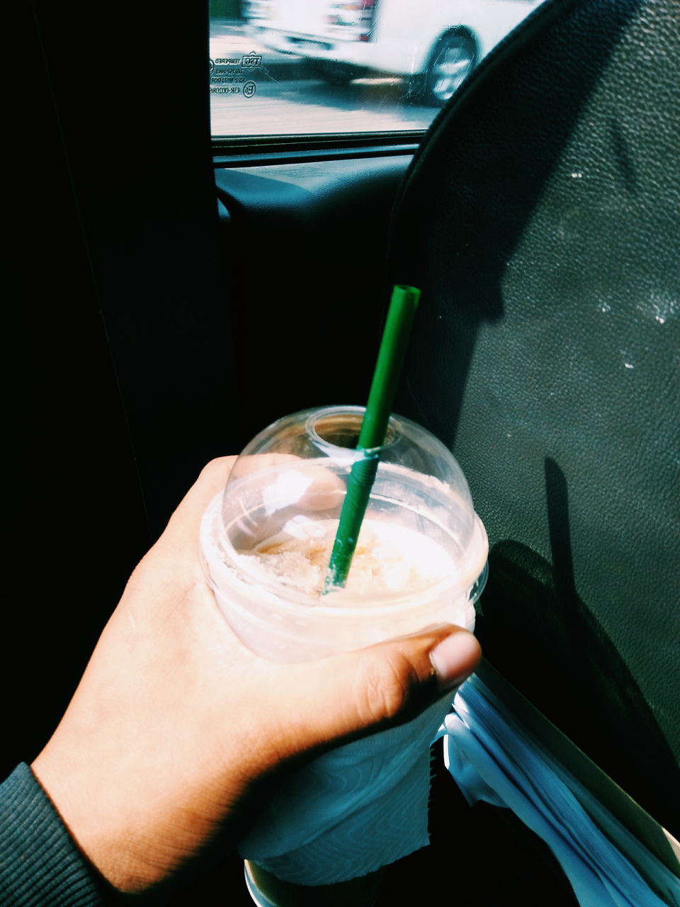 CLOSE-UP OF HAND HOLDING DRINK WITH GLASS