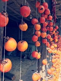 Fruits hanging on string for sale