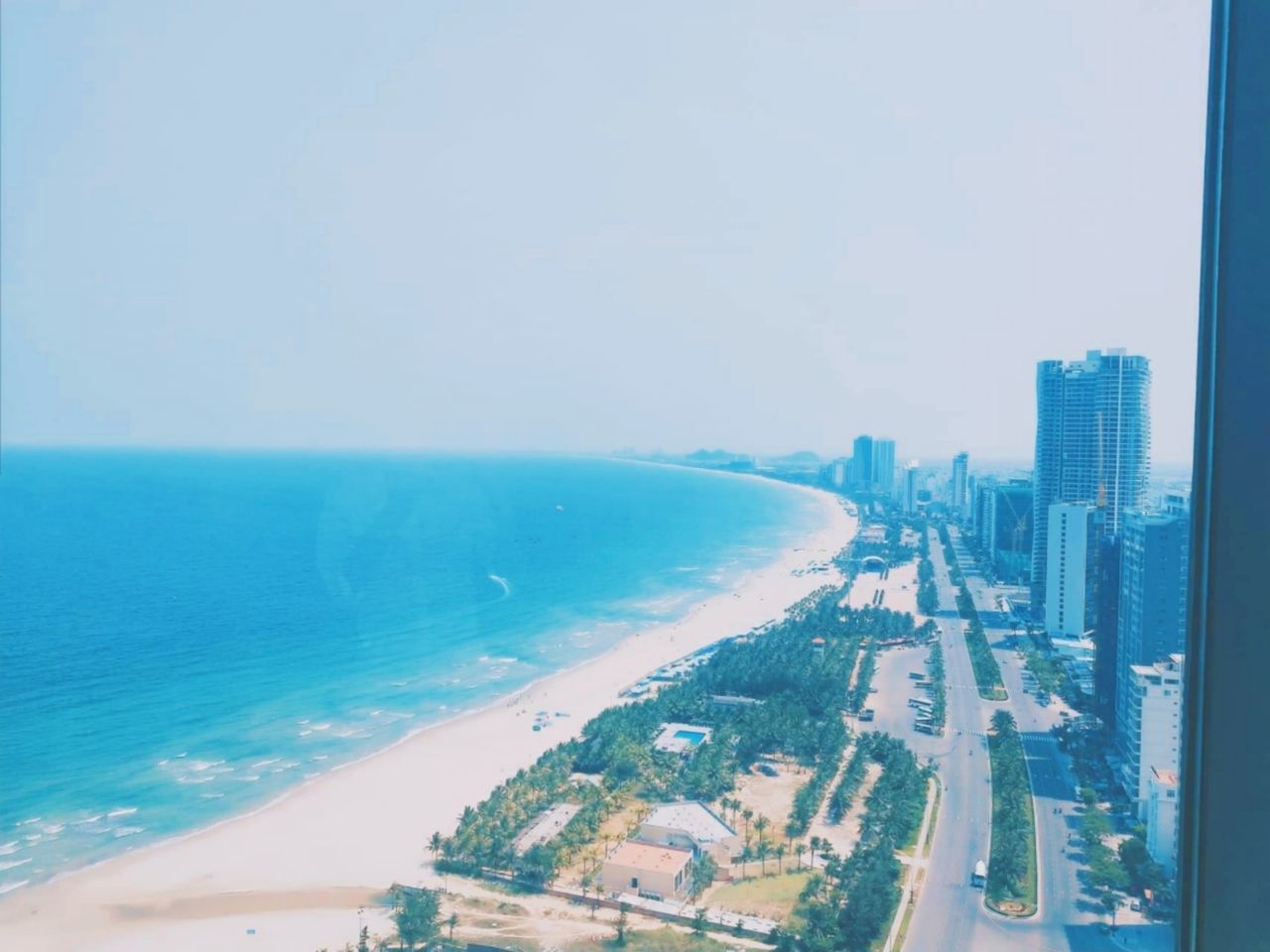 PANORAMIC VIEW OF SEA AND BUILDINGS AGAINST SKY