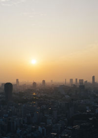 Cityscape against clear sky during sunset