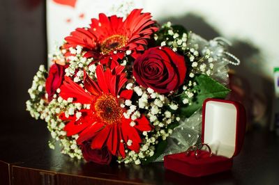 High angle view of red rose bouquet on table