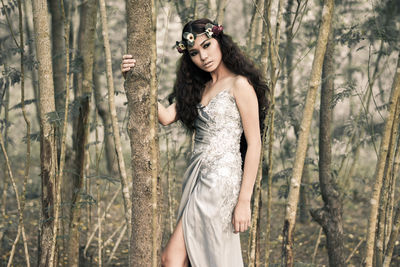 Portrait of young woman in forest