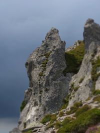 Low angle view of rock formation against sky